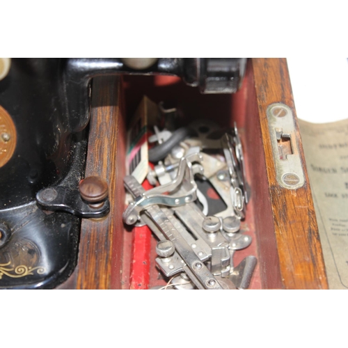 875 - Singer sewing machine in case