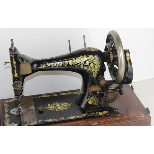 888 - A vintage Singer sewing machine in wooden case