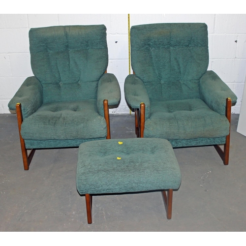 96 - A retro green upholstered show frame sofa, 2 chairs and a foot stool in the manner of Ercol