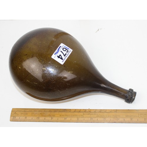 1674 - An antique brown glass free blown wine bottle or flask believed to be 18th century