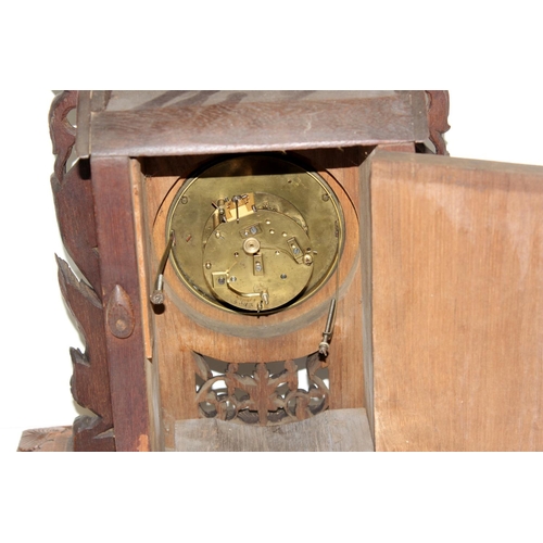 1457 - A highly impressive early 20th century carved hardwood mantle clock in the Anglo-Indian style. Profu... 