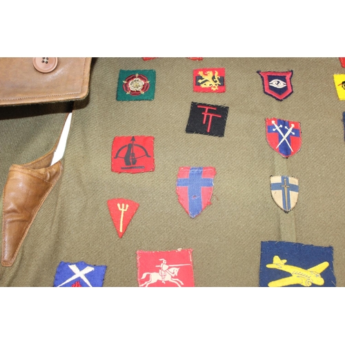 1067 - A 1941 dated WW2 period Camouflage Leather Jerkin by Hector Powe with a large qty of fabric patches ... 