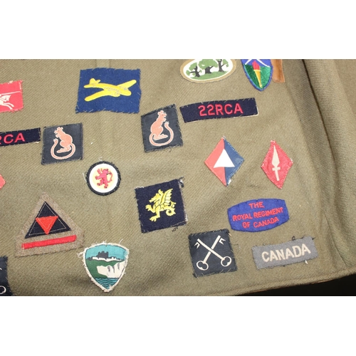 1067 - A 1941 dated WW2 period Camouflage Leather Jerkin by Hector Powe with a large qty of fabric patches ... 