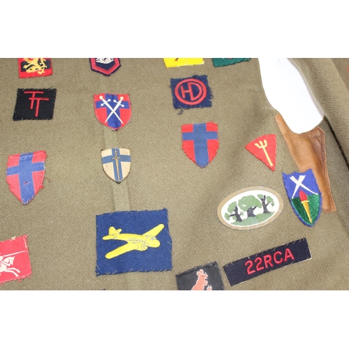 1067 - A 1941 dated WW2 period Camouflage Leather Jerkin by Hector Powe with a large qty of fabric patches ... 