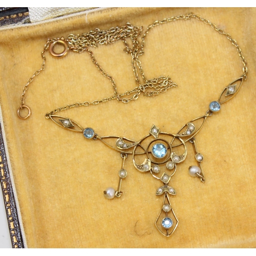 1280 - An Edwardian 9ct gold Art Nouveau pendant set with seed pearls and Aquamarines