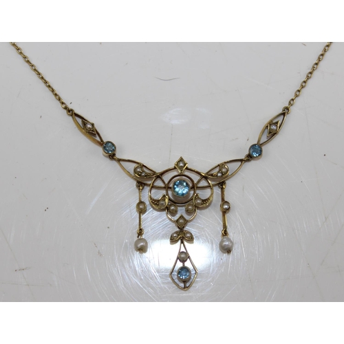 1280 - An Edwardian 9ct gold Art Nouveau pendant set with seed pearls and Aquamarines