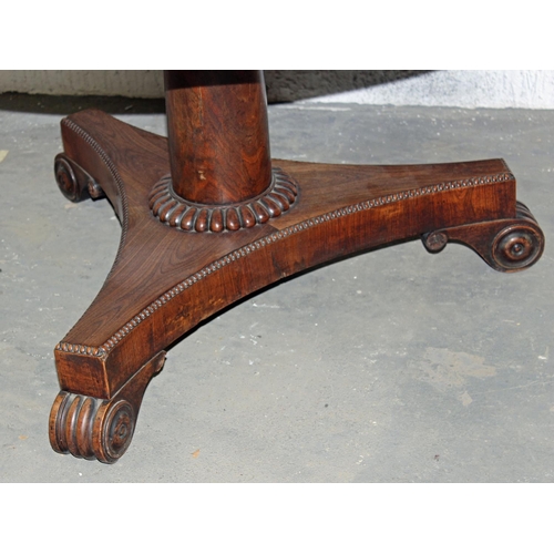 154 - A 19th century Rosewood veneer tilt top table with unusual star design standing on tripod base