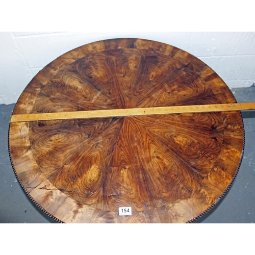 154 - A 19th century Rosewood veneer tilt top table with unusual star design standing on tripod base