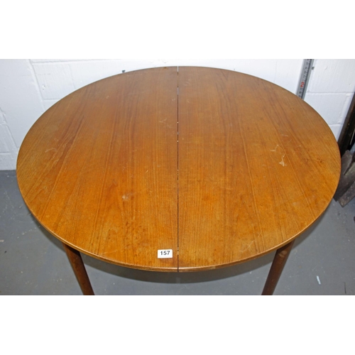 157 - A retro circular extending dining table by A.H. McIntosh of Kirkcaldy