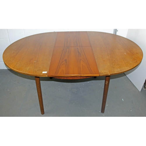 157 - A retro circular extending dining table by A.H. McIntosh of Kirkcaldy