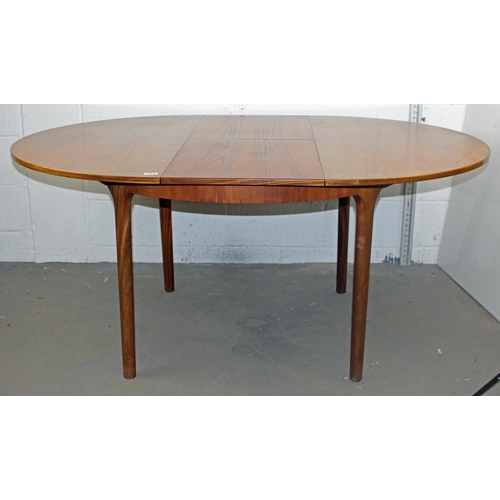 157 - A retro circular extending dining table by A.H. McIntosh of Kirkcaldy