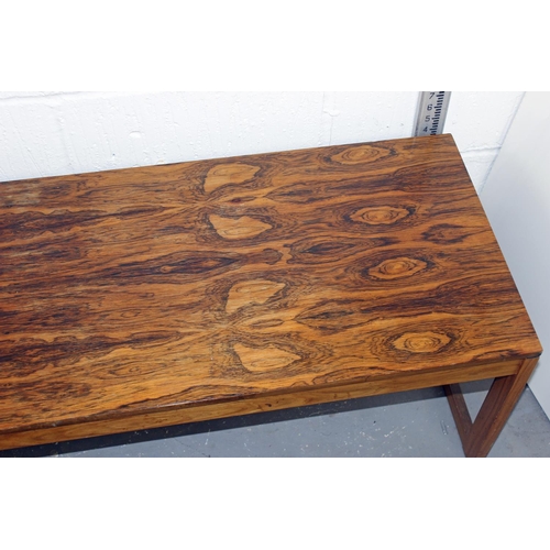 160 - In the manner of Johannes Andersen - a long figured Rosewood veneer retro coffee table likely of Dan... 