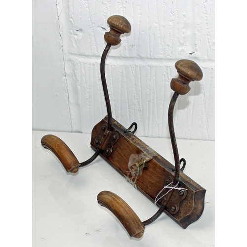 390 - A vintage wooden a metal wall mounted coat and hat rack