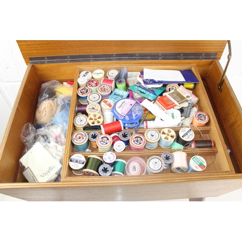 392 - A retro sewing box and contents