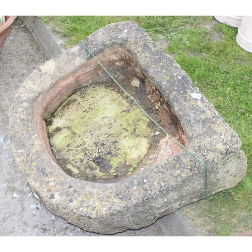 588 - A very large 19th century carved stone sink with rounded end