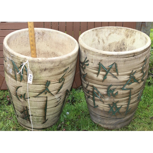 632 - A pair of large ceramic garden planters with incised decoration