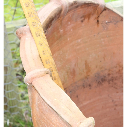 634 - An unusual large terracotta garden planter formed as a flower head