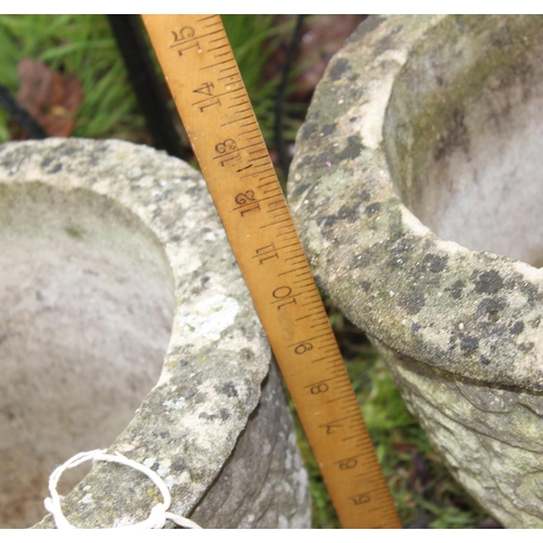 639 - A pair of concrete round planters