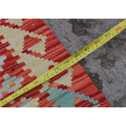 262 - A large vegetable dyed wall Choli Kilim carpet, approx 306cm x 200cm