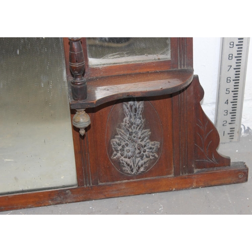 57 - A Victorian over mantle mirror with shelves and carved details