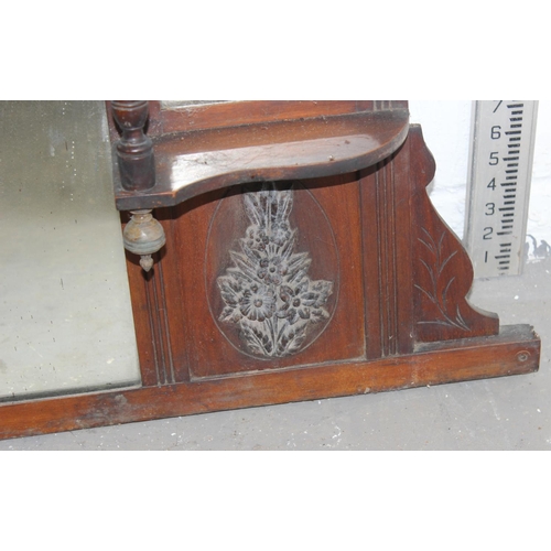 57 - A Victorian over mantle mirror with shelves and carved details