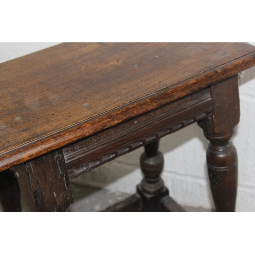 63 - 17th century & later oak coffin or joint stool with carved frieze