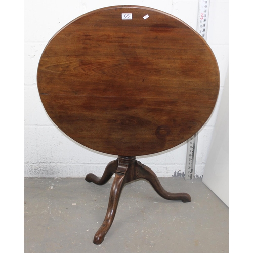 65 - An 18th century circular oak tilt top table, 30