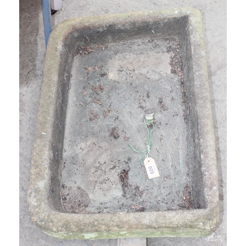 459 - A 19th century carved stone sink with original lead pipe section