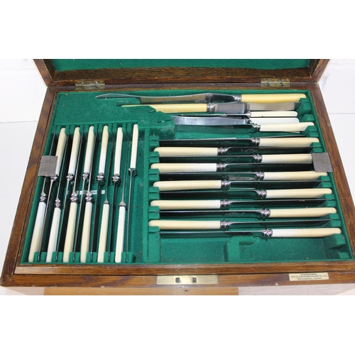 1107 - An early 20th century oak boxed cutlery set by Alexander Clark Co - a good percentage complete