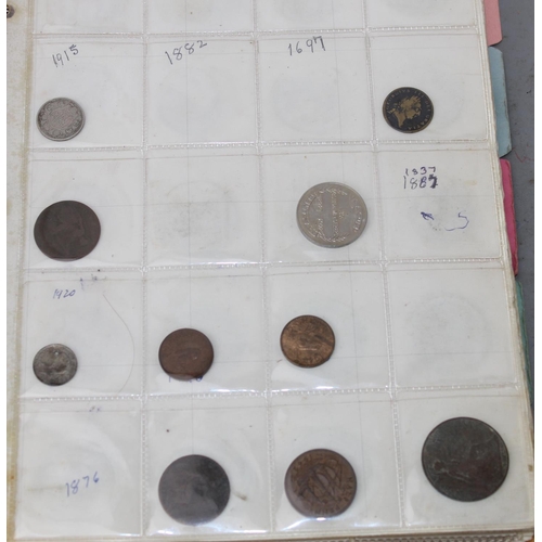 1300 - A folder of assorted coinage, mainly British to inc a qty of silver 3d coins and other silver coins