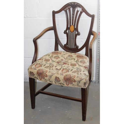 139 - A Georgian Hepplewhite style carver chair with shield back and carved details