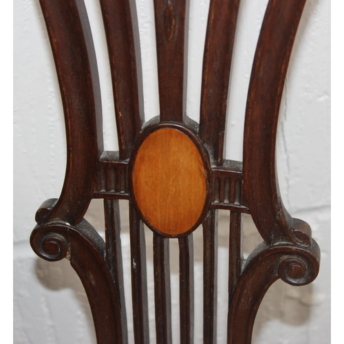 139 - A Georgian Hepplewhite style carver chair with shield back and carved details