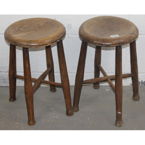 143 - 2 x vintage Elm-seated stools