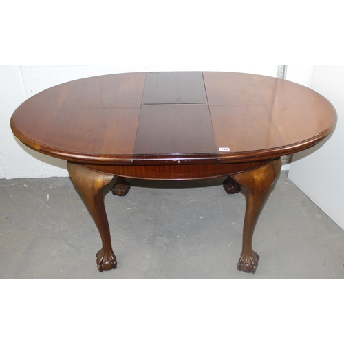 144 - Edwardian extending dining table with impressive ball and claw feet bearing a provisional patent num... 