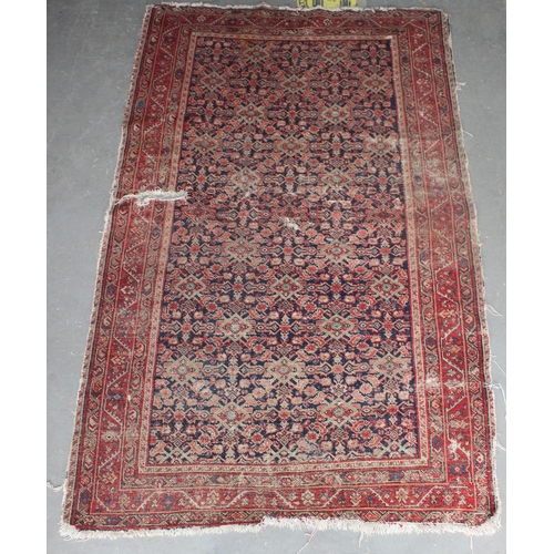 203 - A Mashad style rug on red ground with repeating geometric patterns - likely Persian - purchased from... 