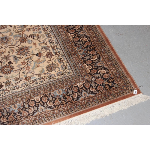 205 - A large modern Super Keshan Prado wool rug of beige ground with Arabesque decoration