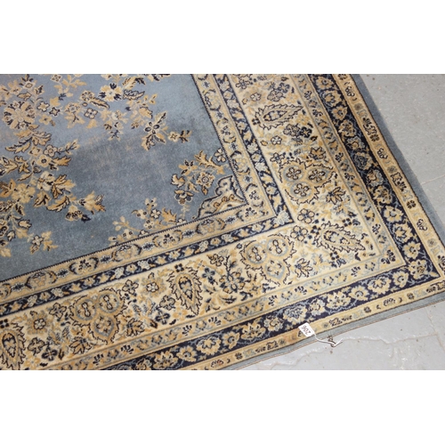 206 - A large modern blue ground rug