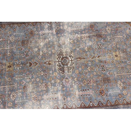 207 - A vintage blue and red ground Saruq style rug decorated profusely