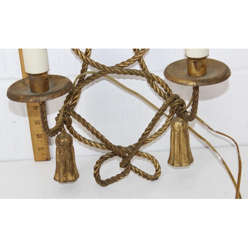 214 - A vintage double wall sconce in gilt metal in a rope twist design - later converted to electricity