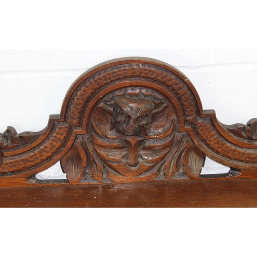 22 - A Victorian Gothic Revival period hall table with carved details in high relief