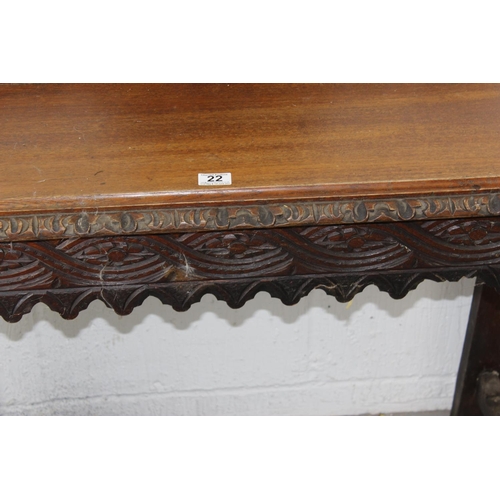 22 - A Victorian Gothic Revival period hall table with carved details in high relief