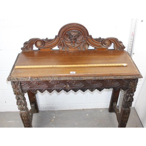 22 - A Victorian Gothic Revival period hall table with carved details in high relief