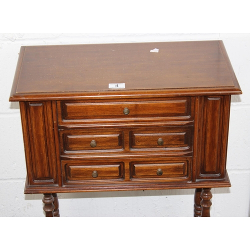 4 - A 20th century cabinet on stand believed to be a jewellery cabinet with opening sides and 3 drawers