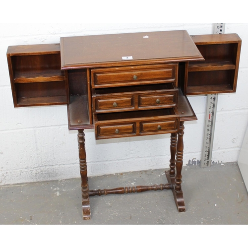 4 - A 20th century cabinet on stand believed to be a jewellery cabinet with opening sides and 3 drawers