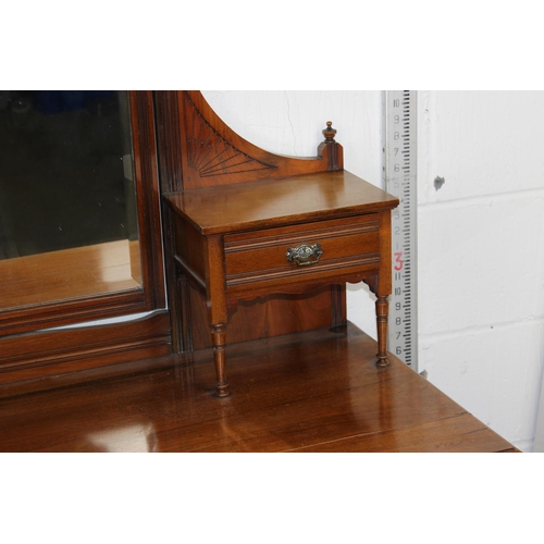 5 - An Edwardian Gothic style dressing chest with various drawers and mirror