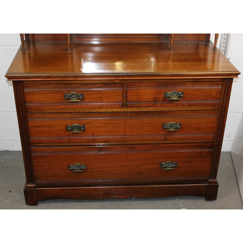 5 - An Edwardian Gothic style dressing chest with various drawers and mirror