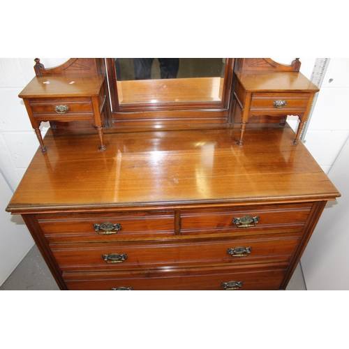 5 - An Edwardian Gothic style dressing chest with various drawers and mirror