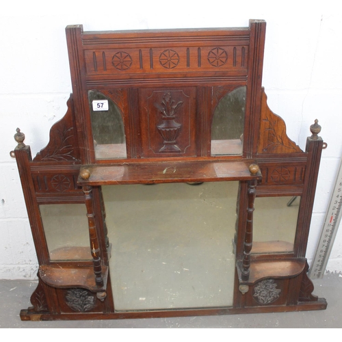 57 - A Victorian over mantle mirror with shelves and carved details