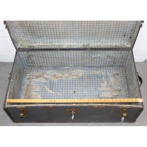 61 - A large vintage travelling trunk