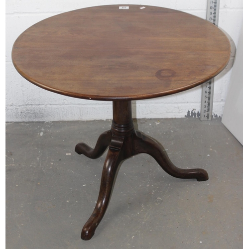 65 - An 18th century circular oak tilt top table, 30